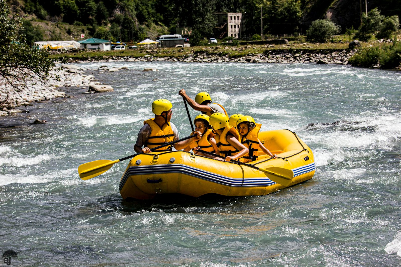 Experience thrilling rafting on the Aragvi River in Ananuri, Georgia, with a vibrant group.