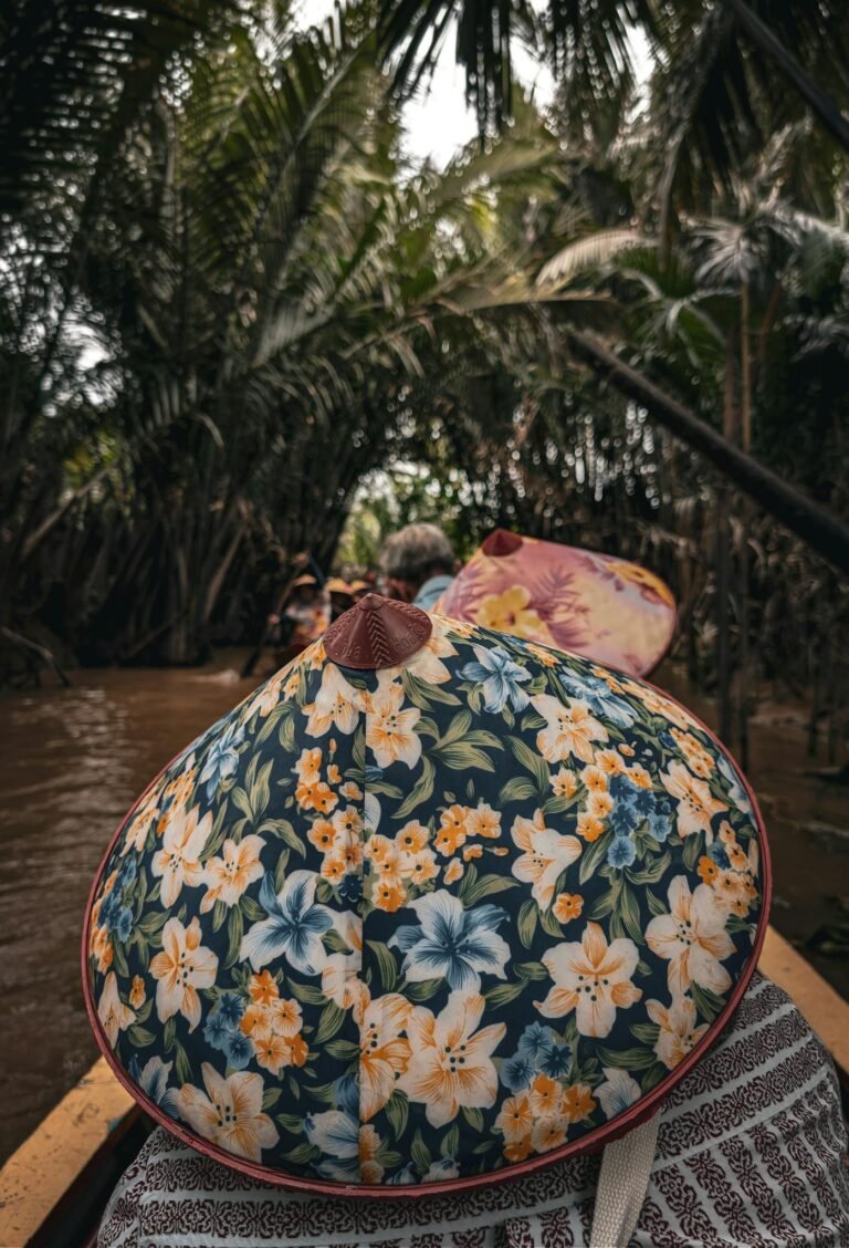 Explore the lush greenery of Vietnam's Mekong Delta on a traditional boat ride.